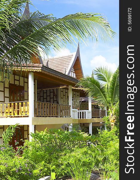 View of nice thai style modern villa in tropic environment. View of nice thai style modern villa in tropic environment