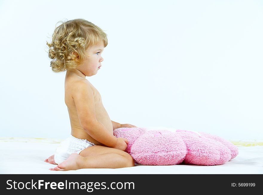 High key portrait of young baby on white back