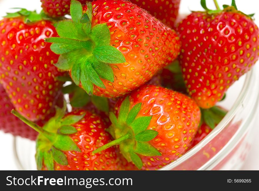 High key photo of fruit dish filled with nice red strawberries. High key photo of fruit dish filled with nice red strawberries