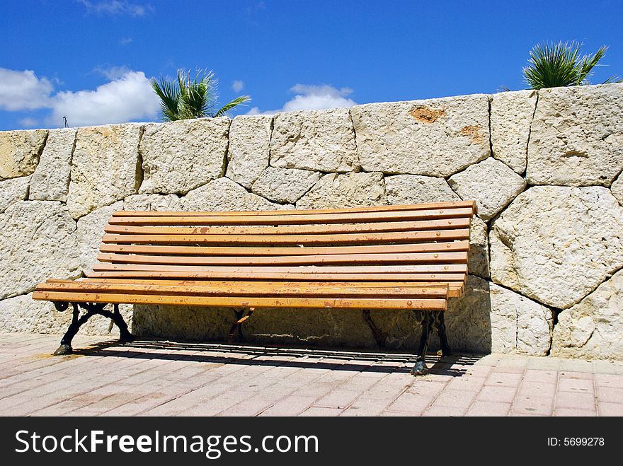 Slatted wooden seat to relax and watch world go by. Slatted wooden seat to relax and watch world go by