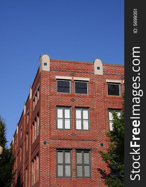 Brick Building Corner with Blue Sky background. Brick Building Corner with Blue Sky background