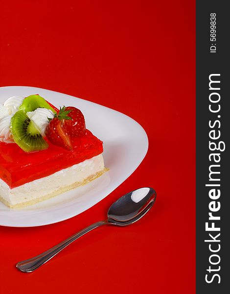 Holiday's cake is made of cream, jelly and fruit. Holiday's cake is made of cream, jelly and fruit.