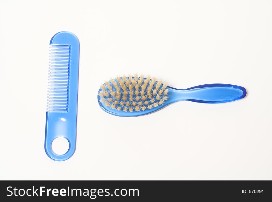 Comb and brush over white