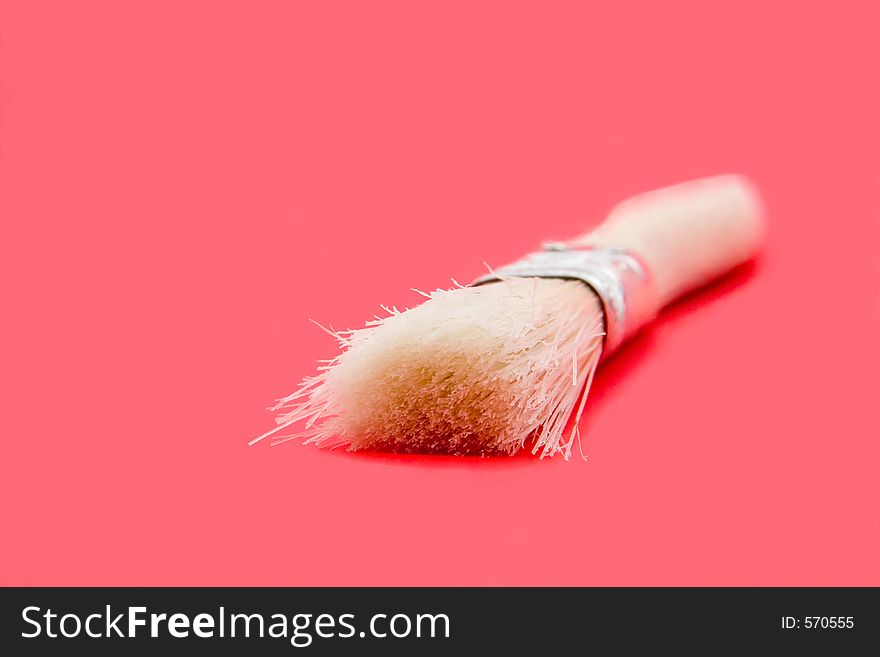 An artist's brush isolated on pink. An artist's brush isolated on pink