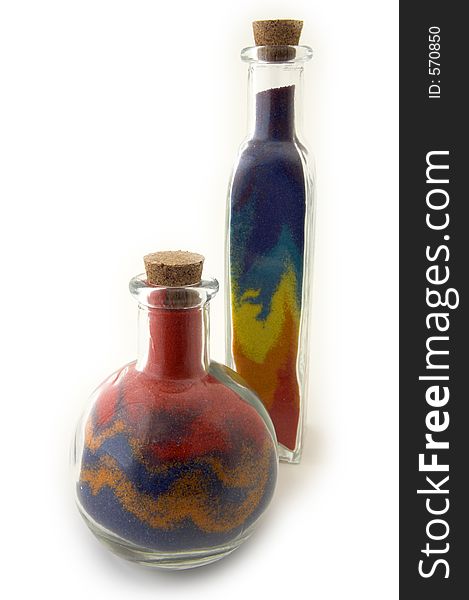 Two bottles with colorful sand