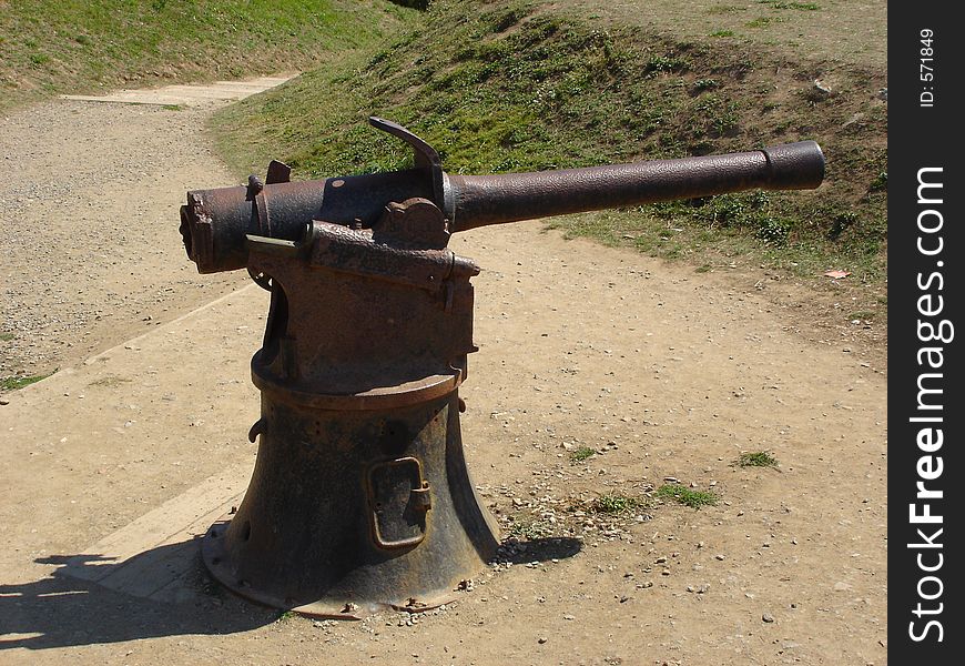 A picture of an old WWII gun in France. A picture of an old WWII gun in France.
