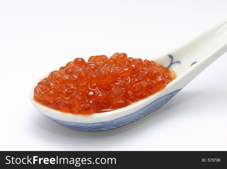 Red caviar on chinese spoon