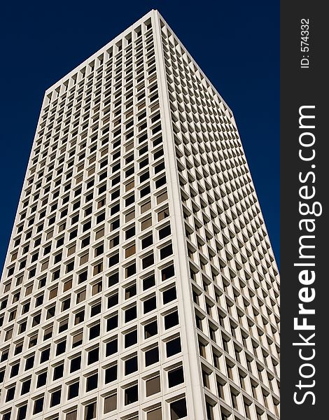 A skyscraper in San Francisco against a blue sky. A skyscraper in San Francisco against a blue sky