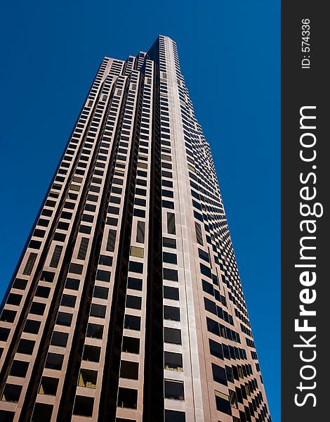 A skyscraper in San Francisco against a blue sky. A skyscraper in San Francisco against a blue sky
