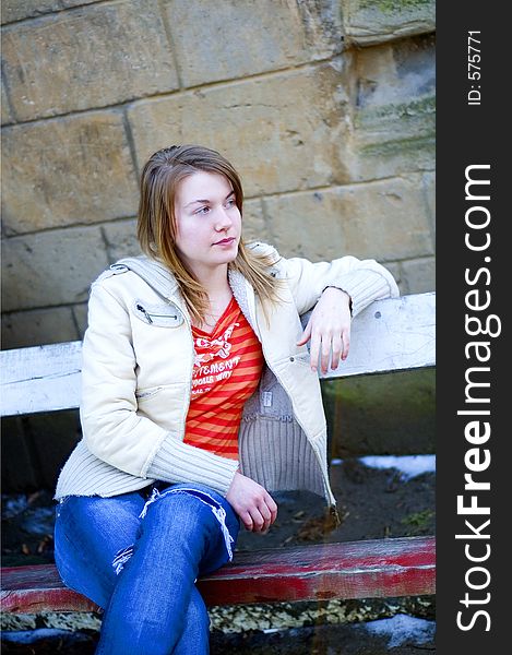 Girl standing on a bench. Girl standing on a bench