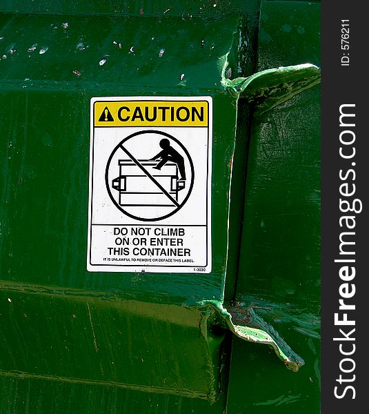 Warning on metal bin. Warning on metal bin
