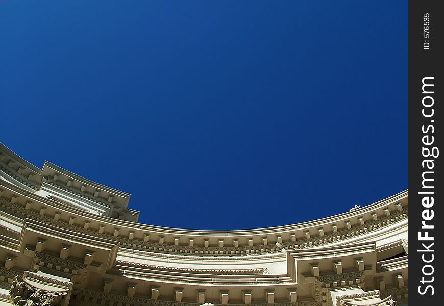 Detail of Roof on interesting building against bright blue sky. Detail of Roof on interesting building against bright blue sky