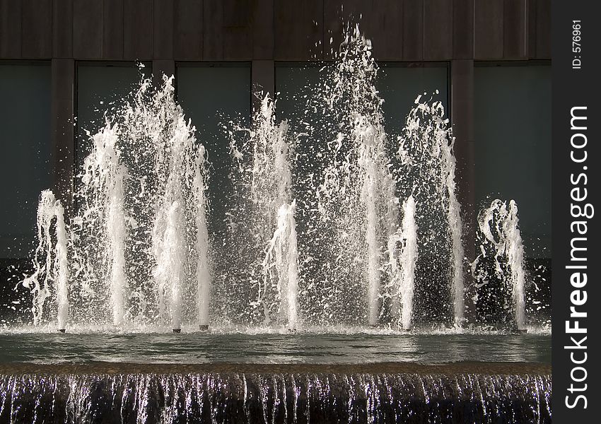 This is a freeze frame shot of water splashing out of a fountain. This is a freeze frame shot of water splashing out of a fountain.