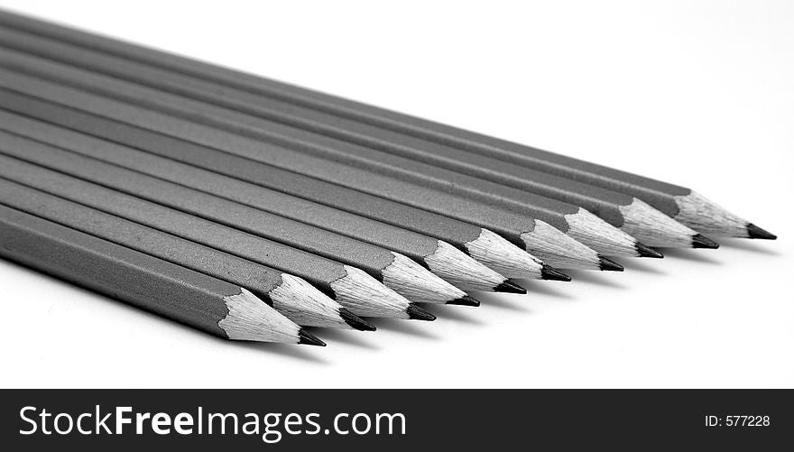 A row of pencils with only a few front ones in focus