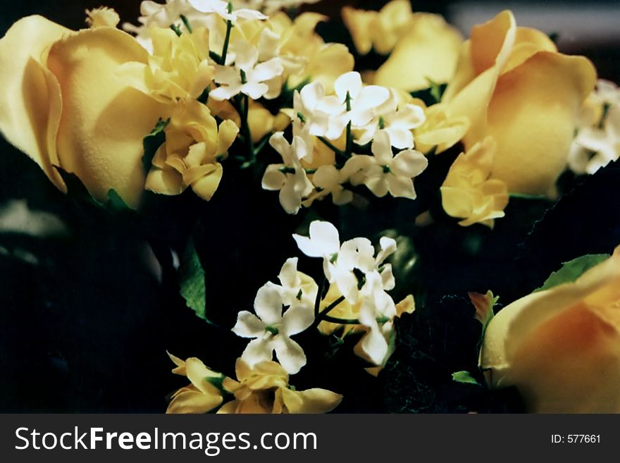 Bouquet of artificial yellow roses.