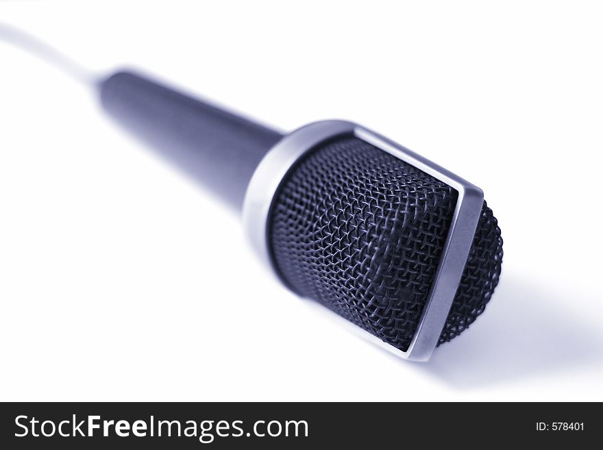 Blue toned microphone against white. Shallow depth of field. Blue toned microphone against white. Shallow depth of field.