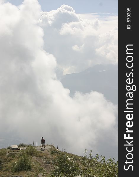 Guy walking among the clouds