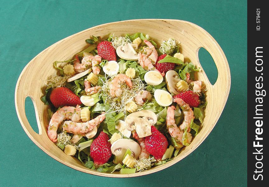 Mixed salad with shrimps, mushrooms and strawberries. Mixed salad with shrimps, mushrooms and strawberries