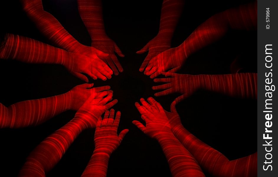 Ethereal red hands reach into center of image. Ethereal red hands reach into center of image