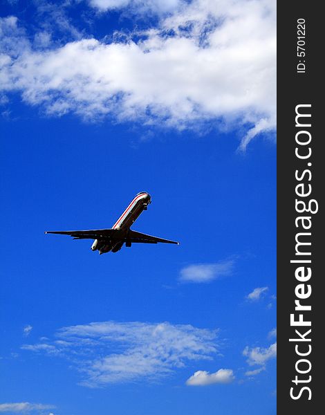 Jet airplane set against a vivid blue sky. Jet airplane set against a vivid blue sky