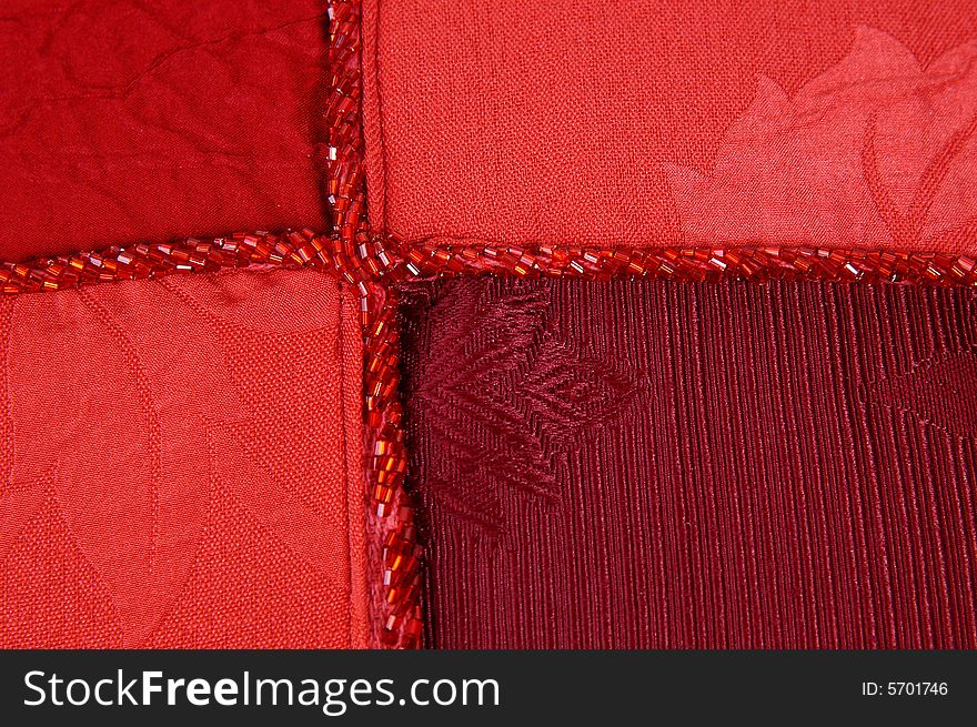 Red fabric decorated with beads