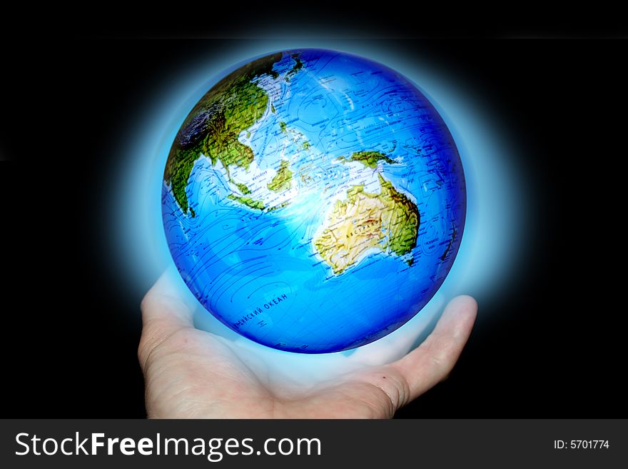 Abstract scene of the hands of the person keeps brighten planet on background cloud. Abstract scene of the hands of the person keeps brighten planet on background cloud