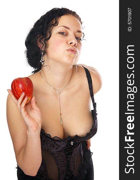 The beautiful girl holds an apple in a hand