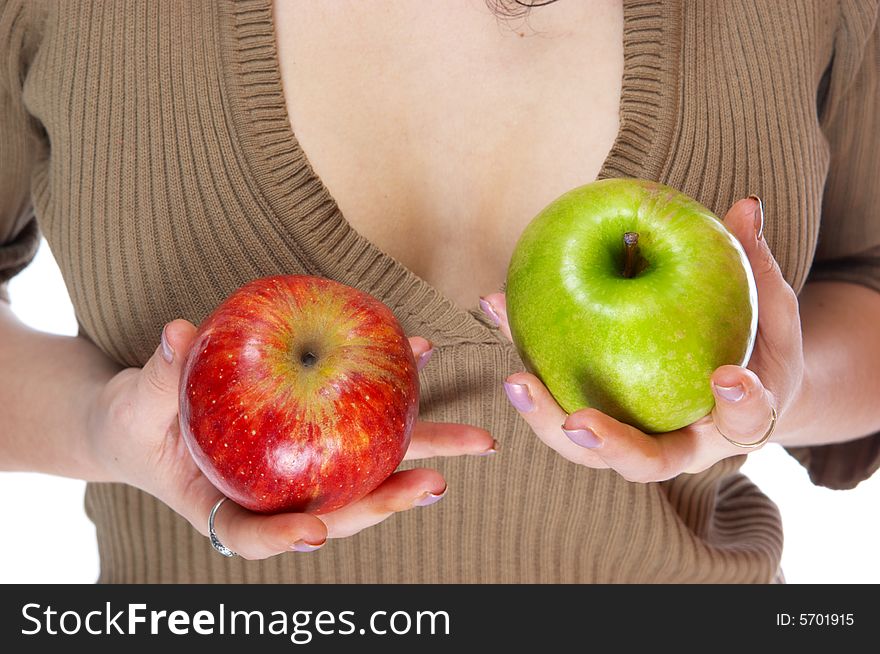 The girl holds an apples. The girl holds an apples