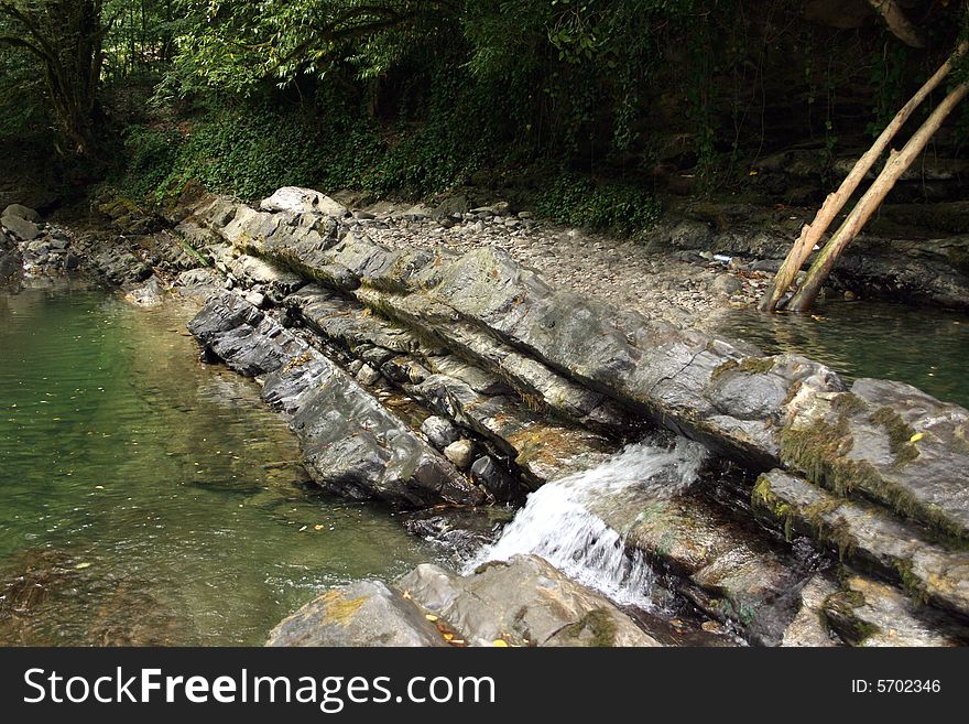 Mountain river in encirclement granite declivity. Mountain river in encirclement granite declivity