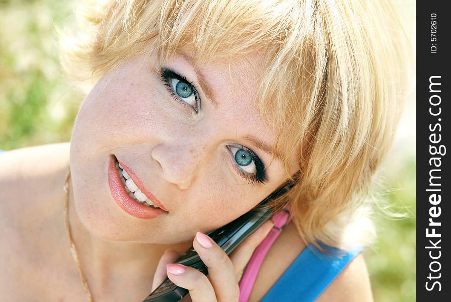 Beautiful girl the blonde speaks by phone