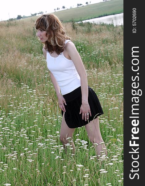 Girl in a filed of flowers