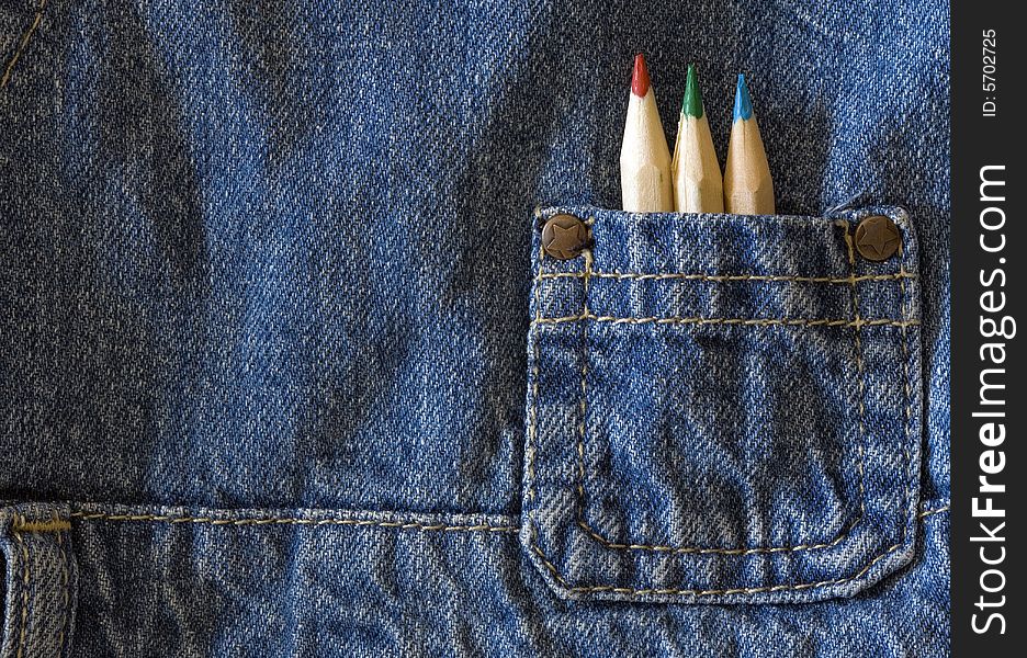 Colors pencil on blue jeans kid pocket