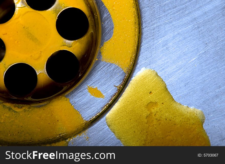 Macro of sink with yellow liquid substance