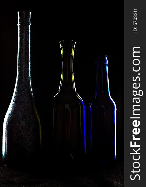 An image of three silhouettes of bottles