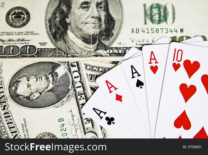Poker cards and dollar bills