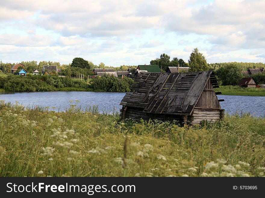 Pond and abandoned sauna on the suburb of the village in Russia. Pond and abandoned sauna on the suburb of the village in Russia.