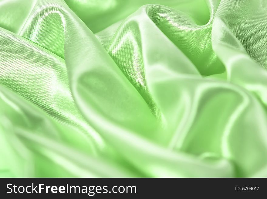 Silk background in green color