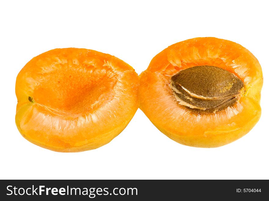 Two half of apricot on a white background