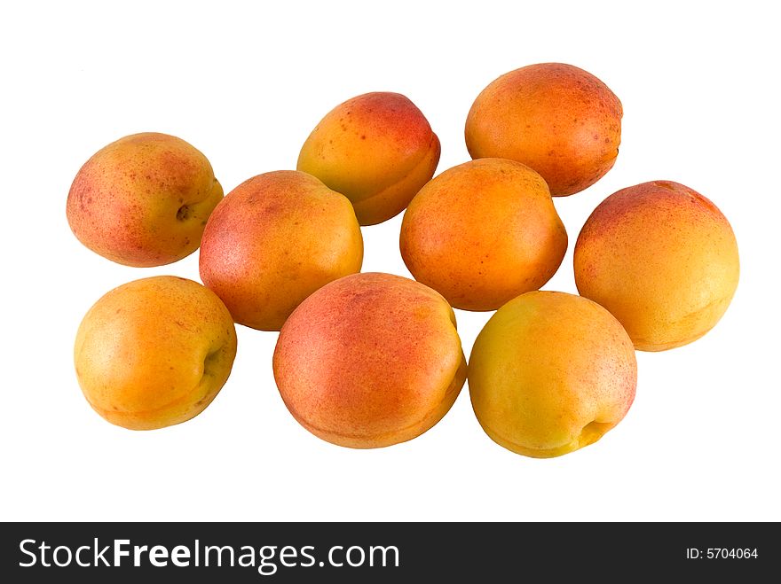 Nine apricot are photographed on a white background. Nine apricot are photographed on a white background