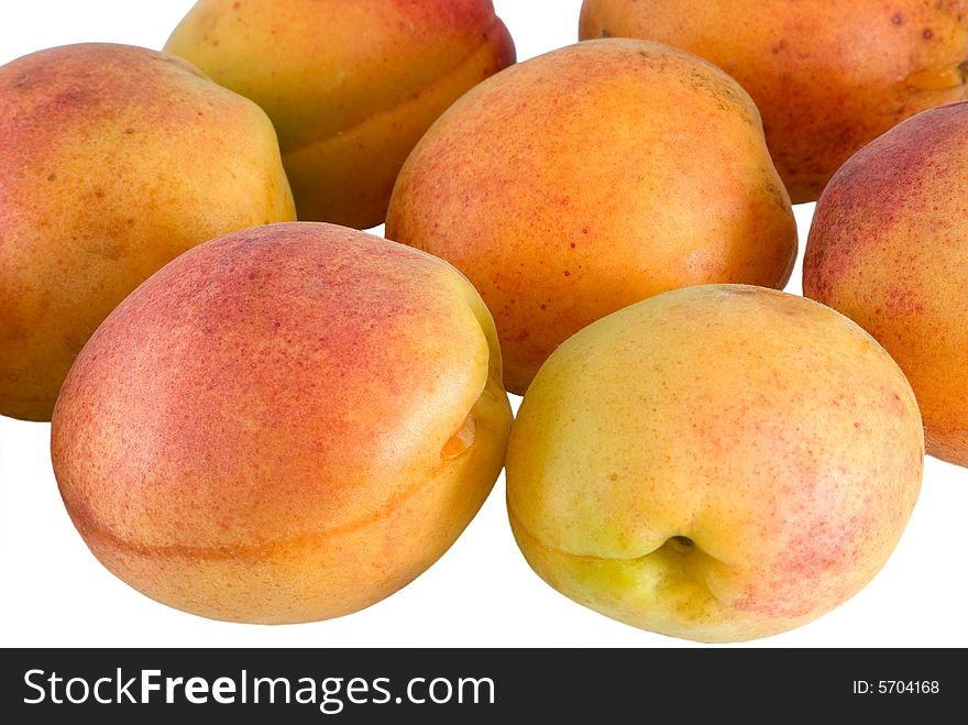 Seven apricot are photographed close-up. Seven apricot are photographed close-up