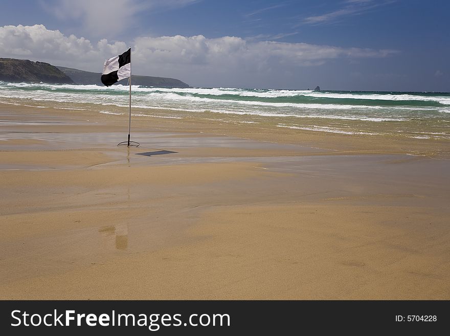 A cornish beach deserted due to high winds