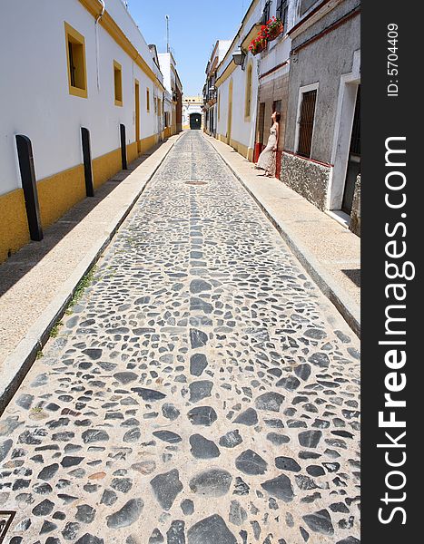 Lonely girl in the street of the small Spanish town of Jerez de la Frontera