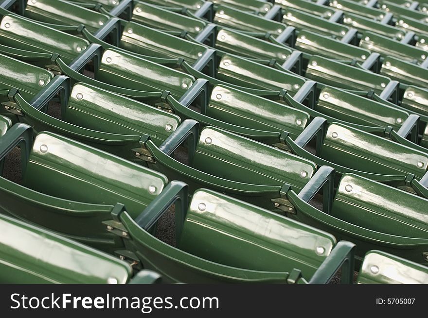 Empty green stadium seating at a baseball game. Empty green stadium seating at a baseball game