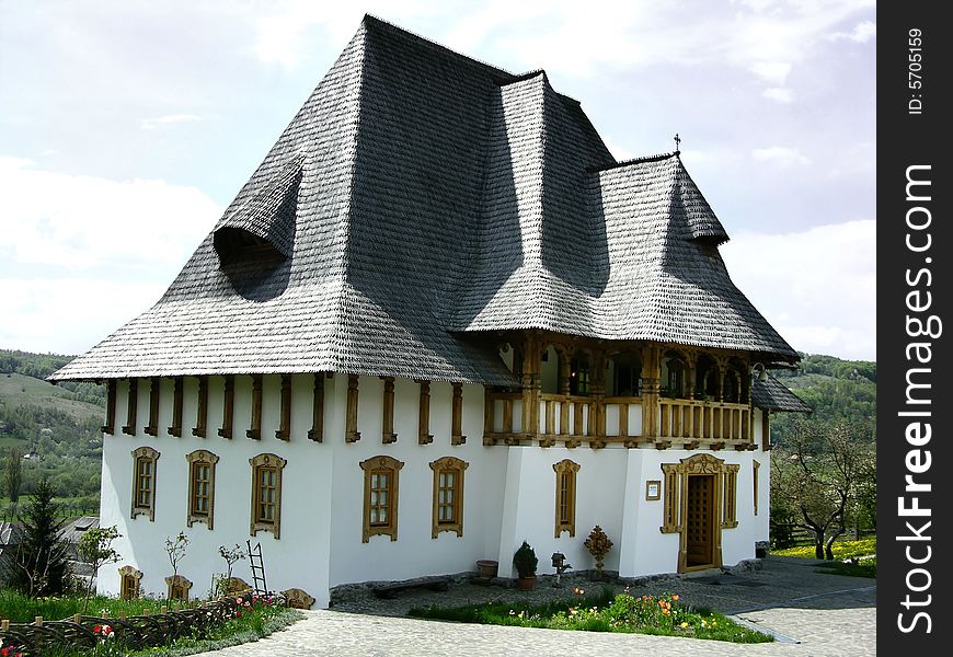 Barsana Monastery is a complex with sixteen nuns. Created after 1989, on the site of a church abandoned in 1790, the complex has become a significant cultural and religious attraction. Its 56 meter-tall church is the tallest wooden structure in Europe. The expressive detail carved into architectural forms by Maramures crafstmen is a reason to visit and stay at Barsana. No power tools or nails were used in the large wooden structures. Its north-Transylvania location puts it close to the Ukrainian border in a hilly forested landscape. Barsana Monastery is a complex with sixteen nuns. Created after 1989, on the site of a church abandoned in 1790, the complex has become a significant cultural and religious attraction. Its 56 meter-tall church is the tallest wooden structure in Europe. The expressive detail carved into architectural forms by Maramures crafstmen is a reason to visit and stay at Barsana. No power tools or nails were used in the large wooden structures. Its north-Transylvania location puts it close to the Ukrainian border in a hilly forested landscape.