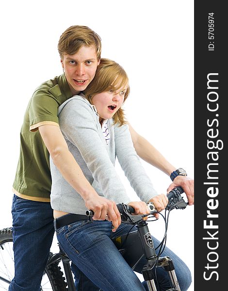 Young couple on a bicycle isolated on a white background