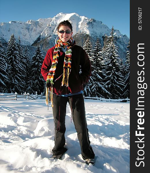 Young girl in winter mountains (Bucegi - Romania)