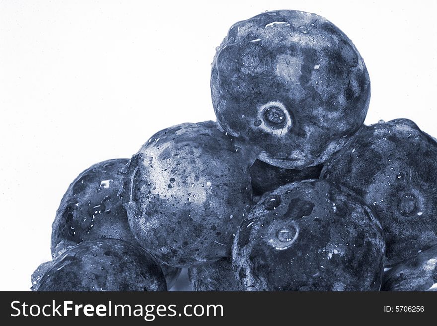 Close-up photo of blueberries on white background