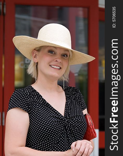 Smiling blond woman wearing a hat. Smiling blond woman wearing a hat.