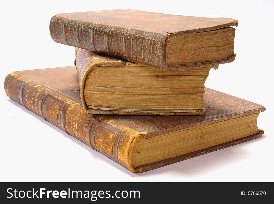 A stack of three old books. A stack of three old books