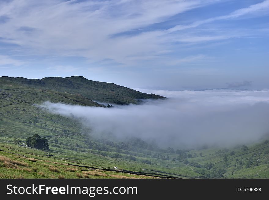 Fog in an English Lake District valley seen from the Kirkstone Pass. Fog in an English Lake District valley seen from the Kirkstone Pass